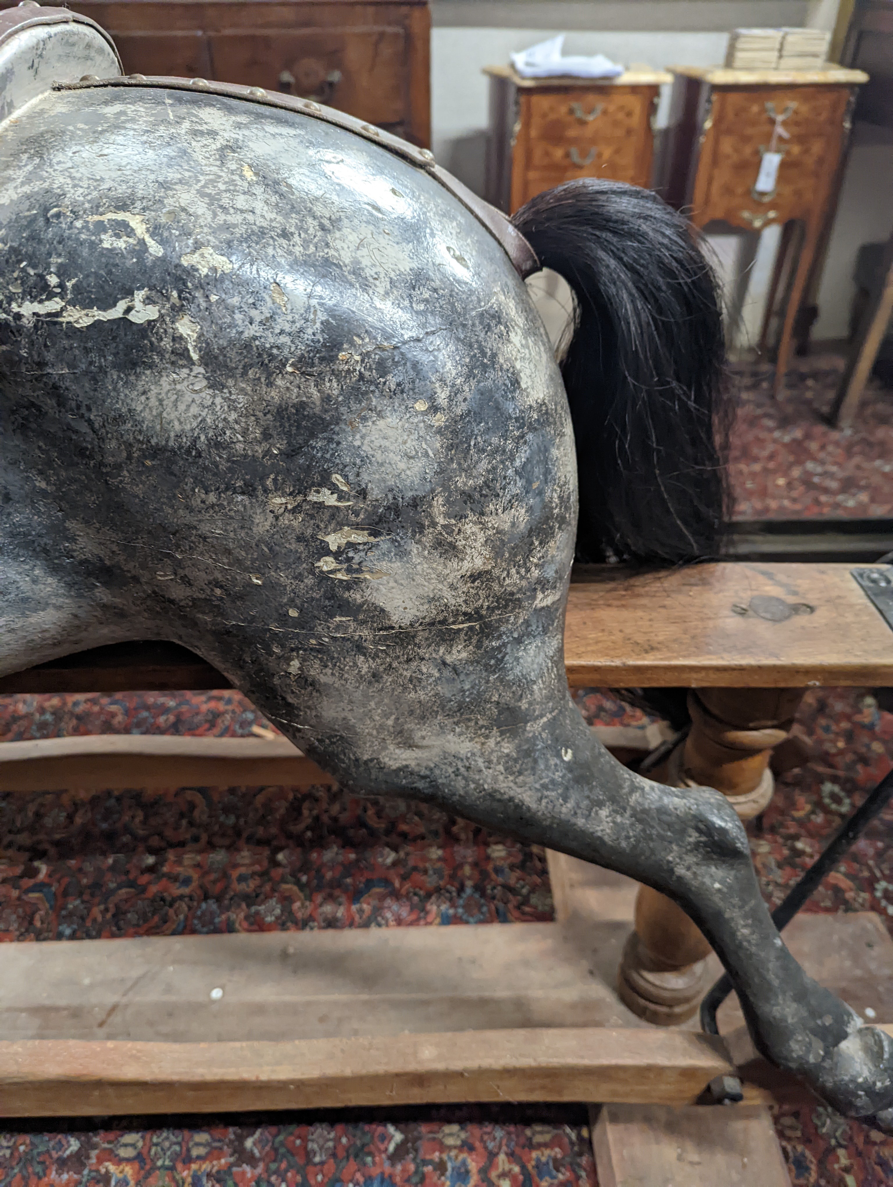 A large Edwardian Ayres type rocking horse on a turned safety frame, length 160cm, height 110cm